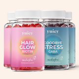 4 yuicy® Dosen im Set. Je zwei Dosen Hair Glow Biotin Gummies für Haargesundheit und Goodbye Stress Gummies mit GABA und L-Theanin zur Unterstützung bei Stress.